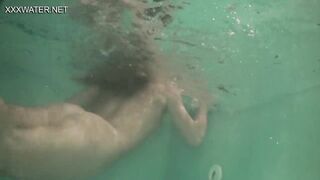 Underwater babe Olga Kukuruzina swims strips and submerged underwater