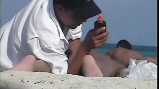 Naked hotties followed around by a nude beach voyeur