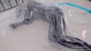 DOVE Latex bodysuit on vacuum bag breathplay