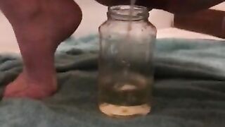 Squatting in front of the mirror to piss in a glass jar (fan request)/ piss fetish