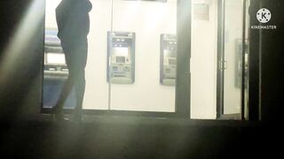 Sissy in slutty dress masturbating her ass in public ATM with dildo at night