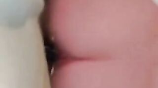 Petite girl bouncing on dildo