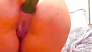 Horny slut fuck her ass with a huge cucumber and dripping out her pussy