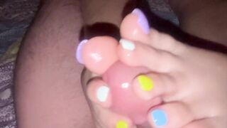 Rainbow nails footjob on big dick