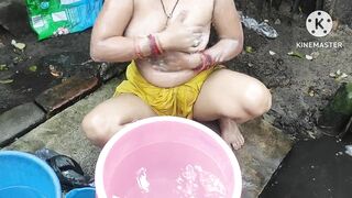 Indian bhabhi bathing outside with