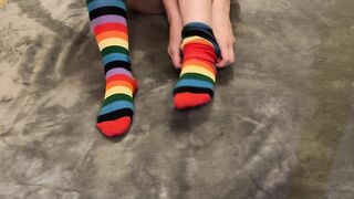 Musical student taking off rainbow socks