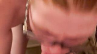 Red headed cutie swallows a mouthful