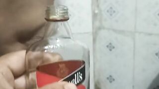 Bhabi pissing in rum bottle