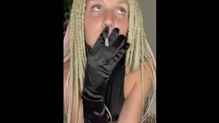 girl in gloves smokes cigarettes