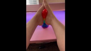 Giving my favorite rainbow cock a teasing footjob