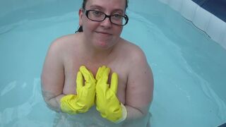 Naked rubber gloves fetish in the hot tub