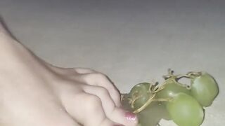 Smashing juicy grapes under my big toes close up under and side pov