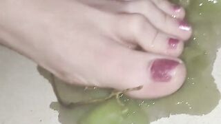 Smashing juicy grapes under my big toes close up under and side pov