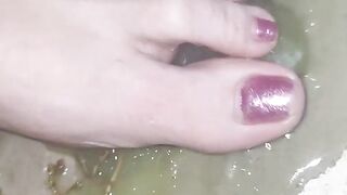 Smashing juicy grapes under my big toes close up under and side pov